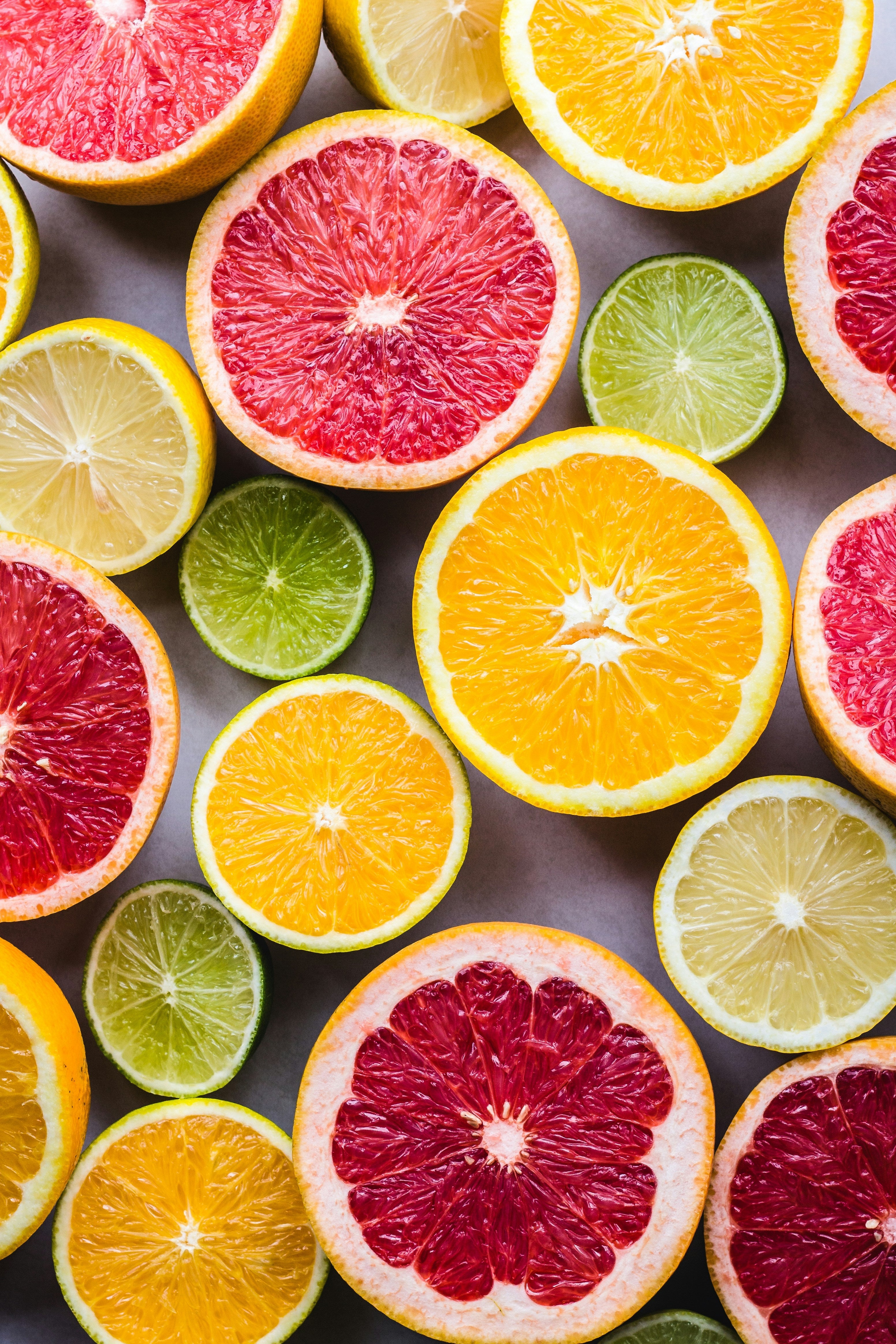 Colorful assortment of citrus fruits including oranges, lemons, limes, and grapefruits for fresh vitamins intake.