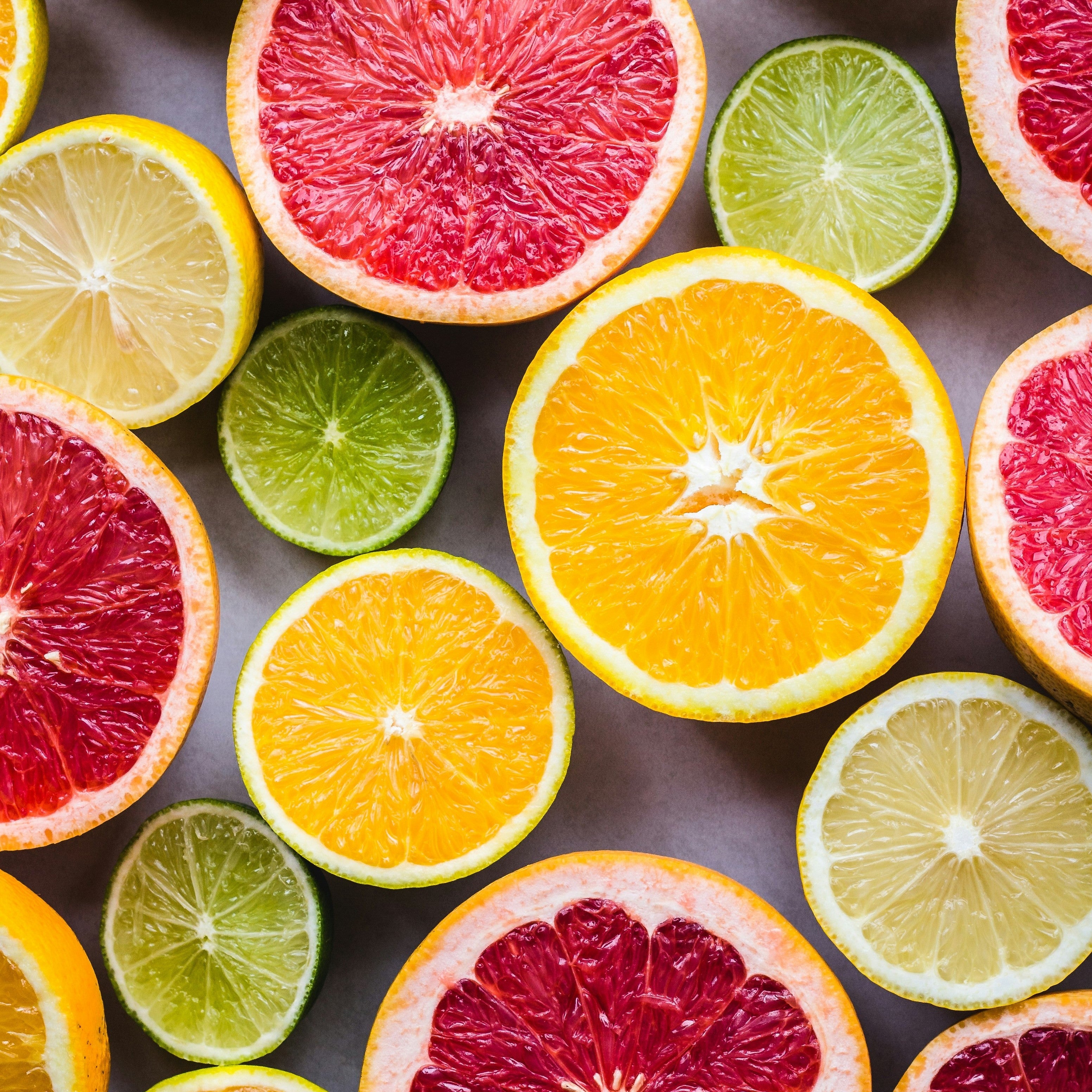 Colorful assortment of citrus fruits including oranges, lemons, limes, and grapefruits for fresh vitamins intake.