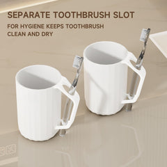 Toothbrush case paired with cup on bathroom sink countertop