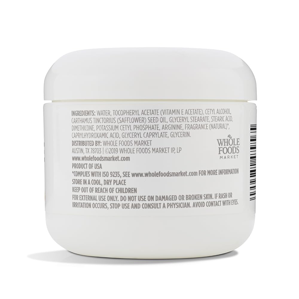 Applying 365 Vitamin E Cream to skin for deep, lasting moisture.