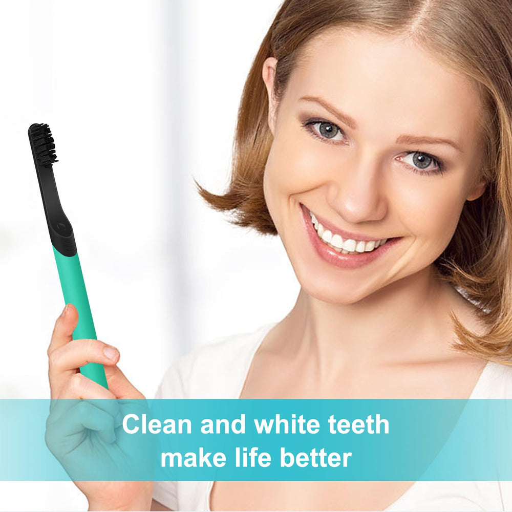Lifestyle shot of four black replacement heads with toothbrush