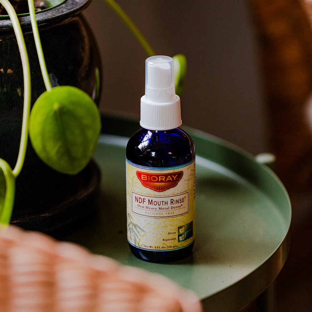 Graphic highlighting NDF Mouth Rinse benefits: binds toxins and supports gum health