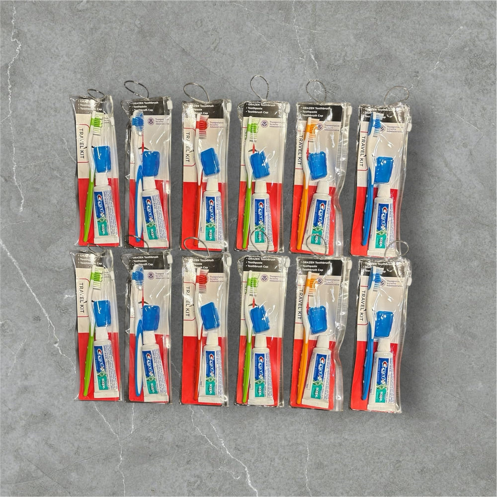 Each kit includes toothbrush with cap, toothpaste, and reusable bag