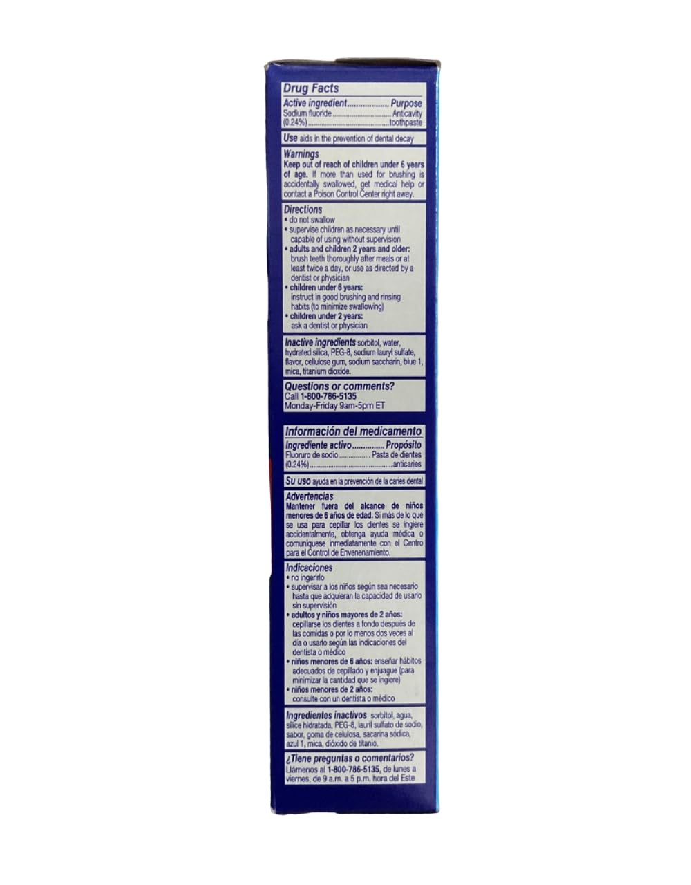 Close-up of toothpaste tube label showing fluoride and berry flavor