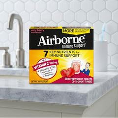 Effervescent tablets dissolving in a glass with bubbles.