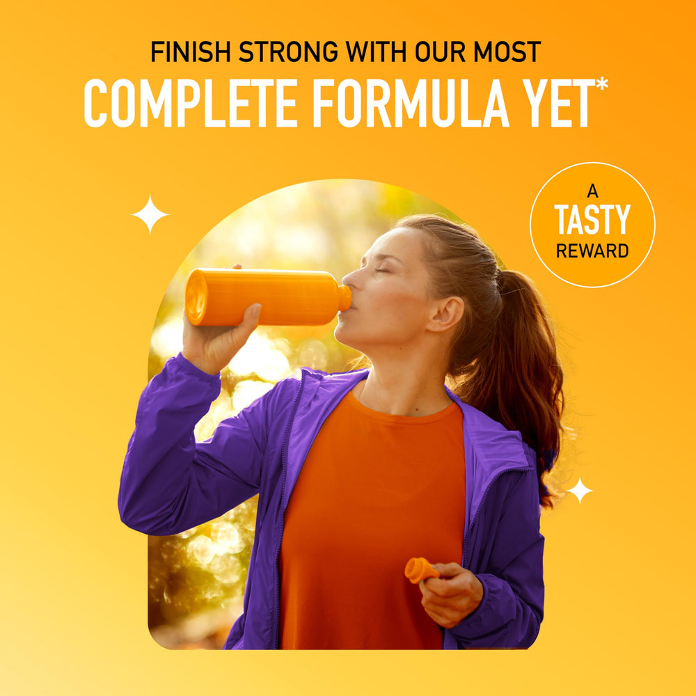 Airborne fizzing tablet in a glass with sparkling water.