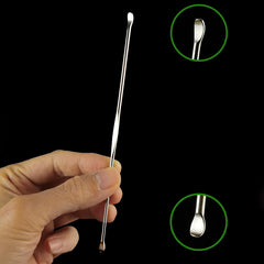 Close-up of stainless steel tonsil stone remover pick