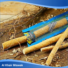 Hands holding Miswak stick for brushing action