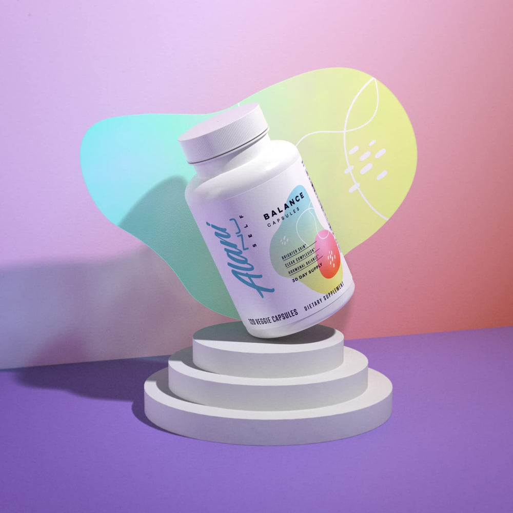 Capsules displayed next to the Alani Nu Hormonal Balance bottle