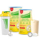 Almased starter kit almond vanilla cans on table, convenient protein-packed meal replacement.
