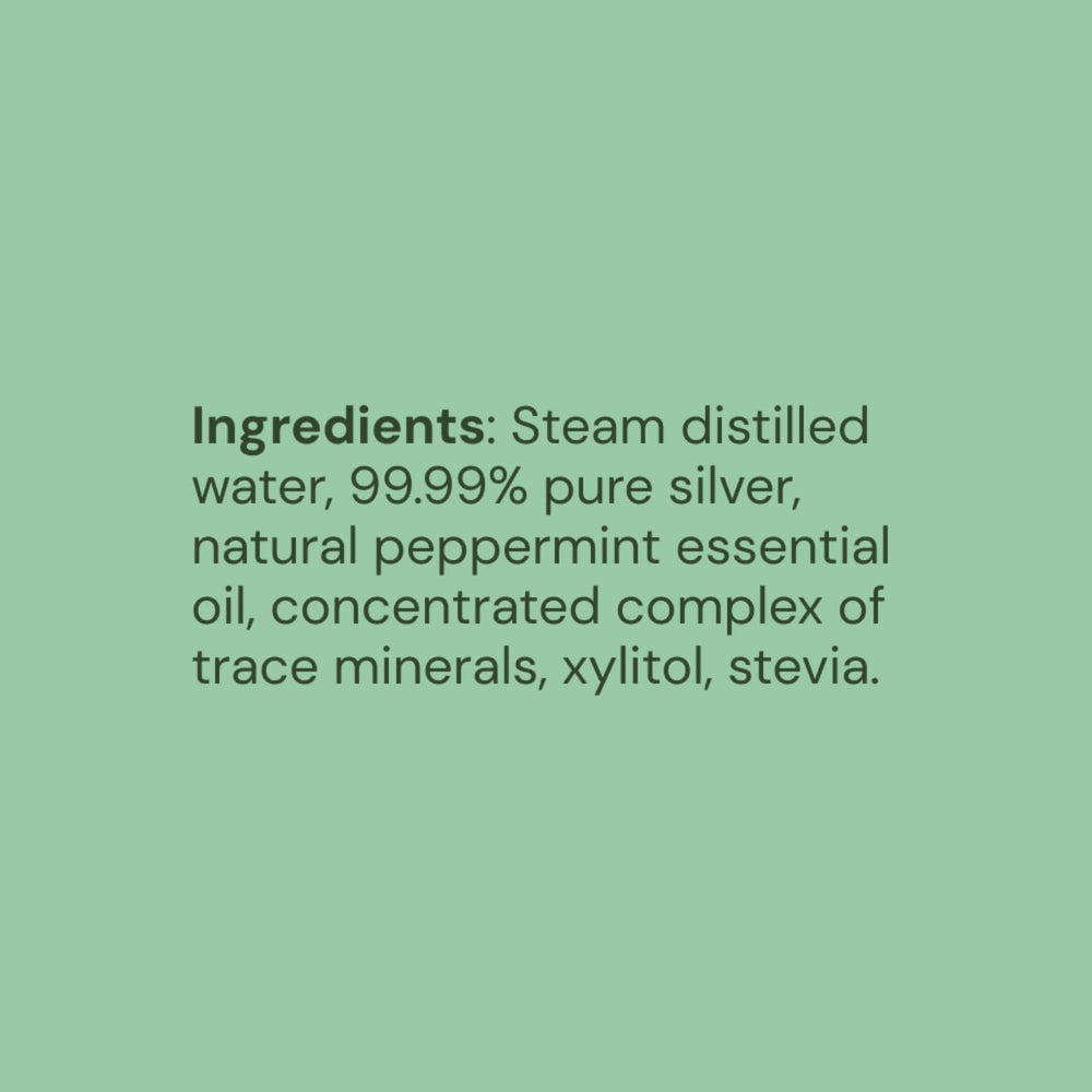 Close-up of mint-flavored mouthwash liquid in a clear bottle
