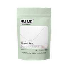 Scoop of Amy Myers MD Organic Reds Superfood Powder with beet root and berries