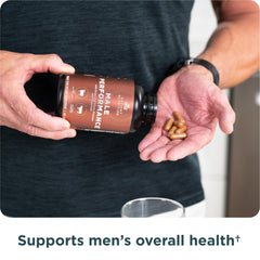 Man taking organ supplement for performance
