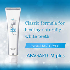 Close-up of APAGARD M-Plus toothpaste packaging and label for fluoride-free formula