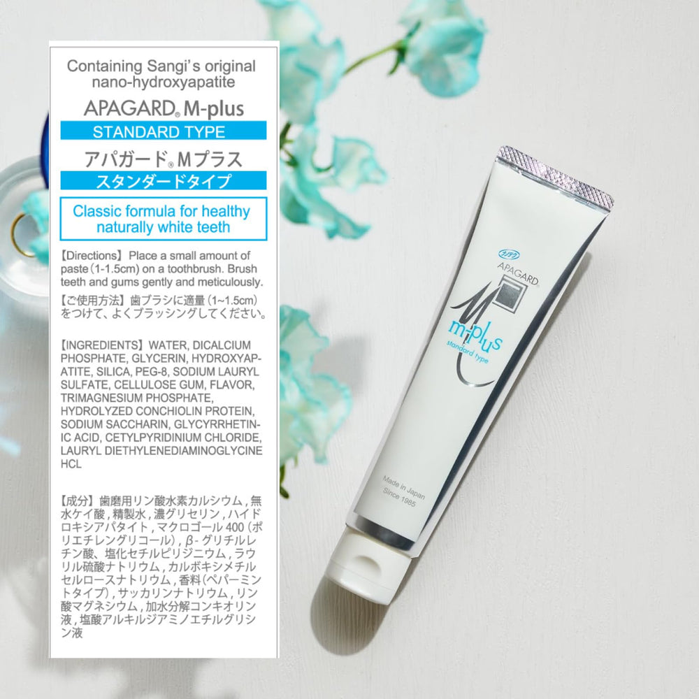 Toothbrush with APAGARD M-Plus toothpaste showing minty foam and brushing guidance