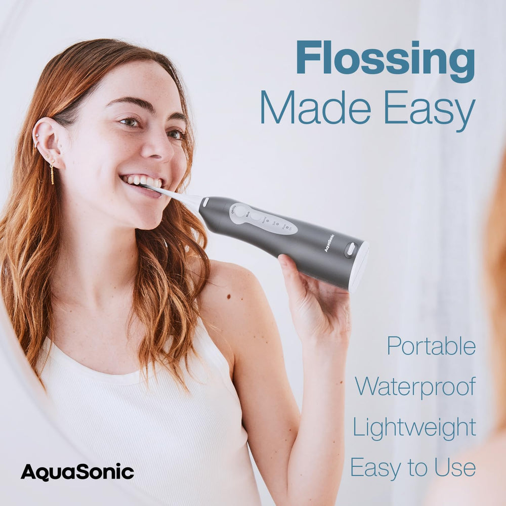 Close-up of AquaSonic cordless water flosser with handle and nozzle