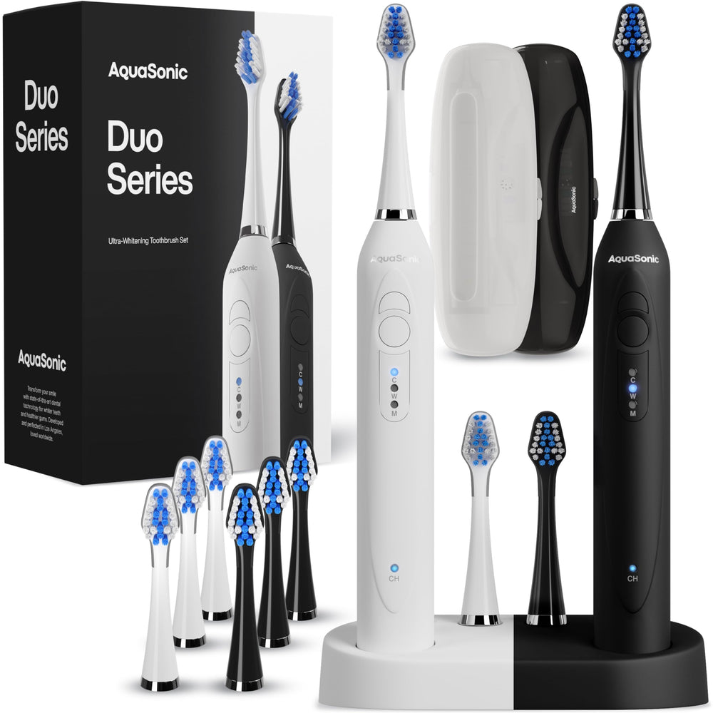 Aquasonic Duo dual-handle electric toothbrushes in black and white with wireless charging dock