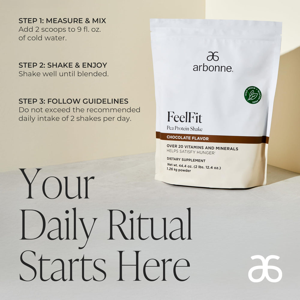 Arbonne Feelfit pea protein scoop close-up emphasizing 20g protein per serving