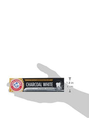 Smiling person with brighter teeth using Arm & Hammer Charcoal White toothpaste