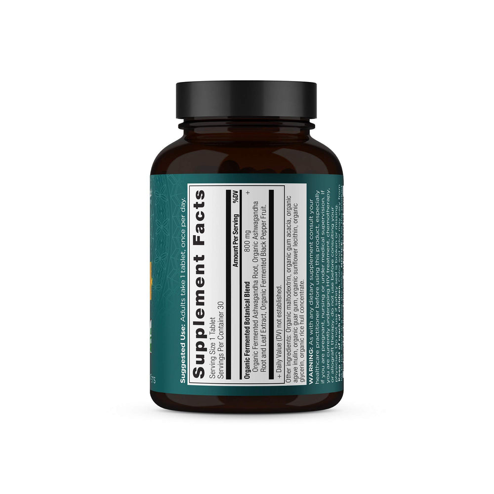 Daily-use bottle of Ashwagandha tablets with glass of water