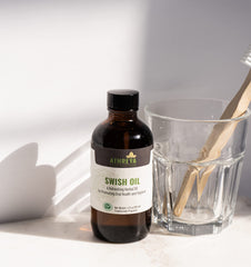Lifestyle shot of Swish Oil with fresh breath context