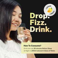 Person enjoying a glass of lemon-honey flavored Auric Flush365