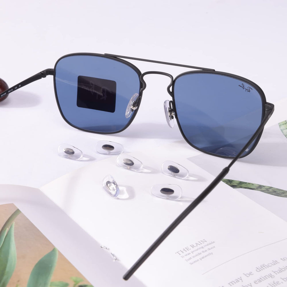 Five pairs of replacement Ray-Ban nose pads in silver coloration
