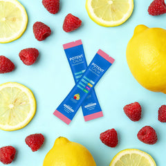 Close-up of PotentCalm Raspberry Lemonade powder scoop