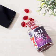 Berry-flavored B-12 gummies with natural backdrop