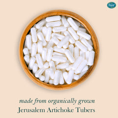 Capsules arranged beside bottle