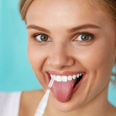 Using BBTO braces brush flosser for cleaning teeth