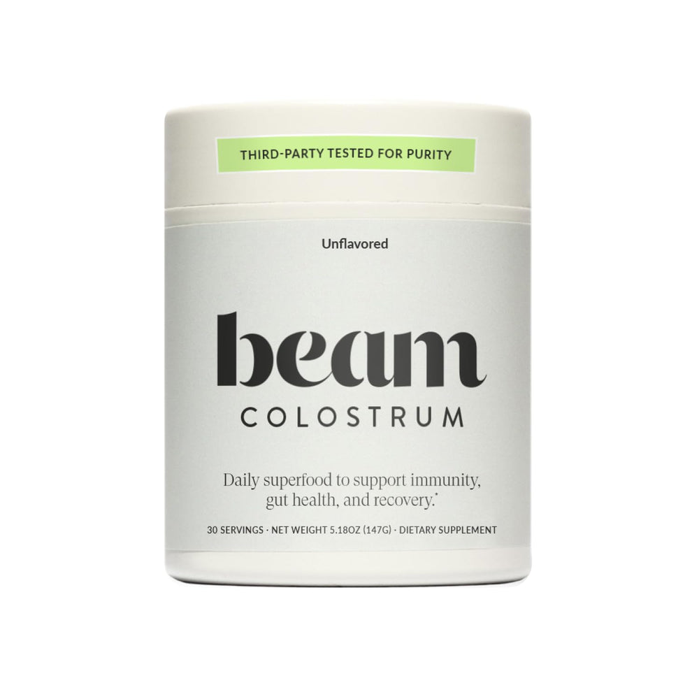Beam Colostrum Powder bottle label with 3g serving claim and grass-fed source