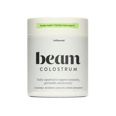 Beam Colostrum Powder bottle label with 3g serving claim and grass-fed source