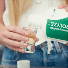 Electrolyze bottle with glass of water nearby