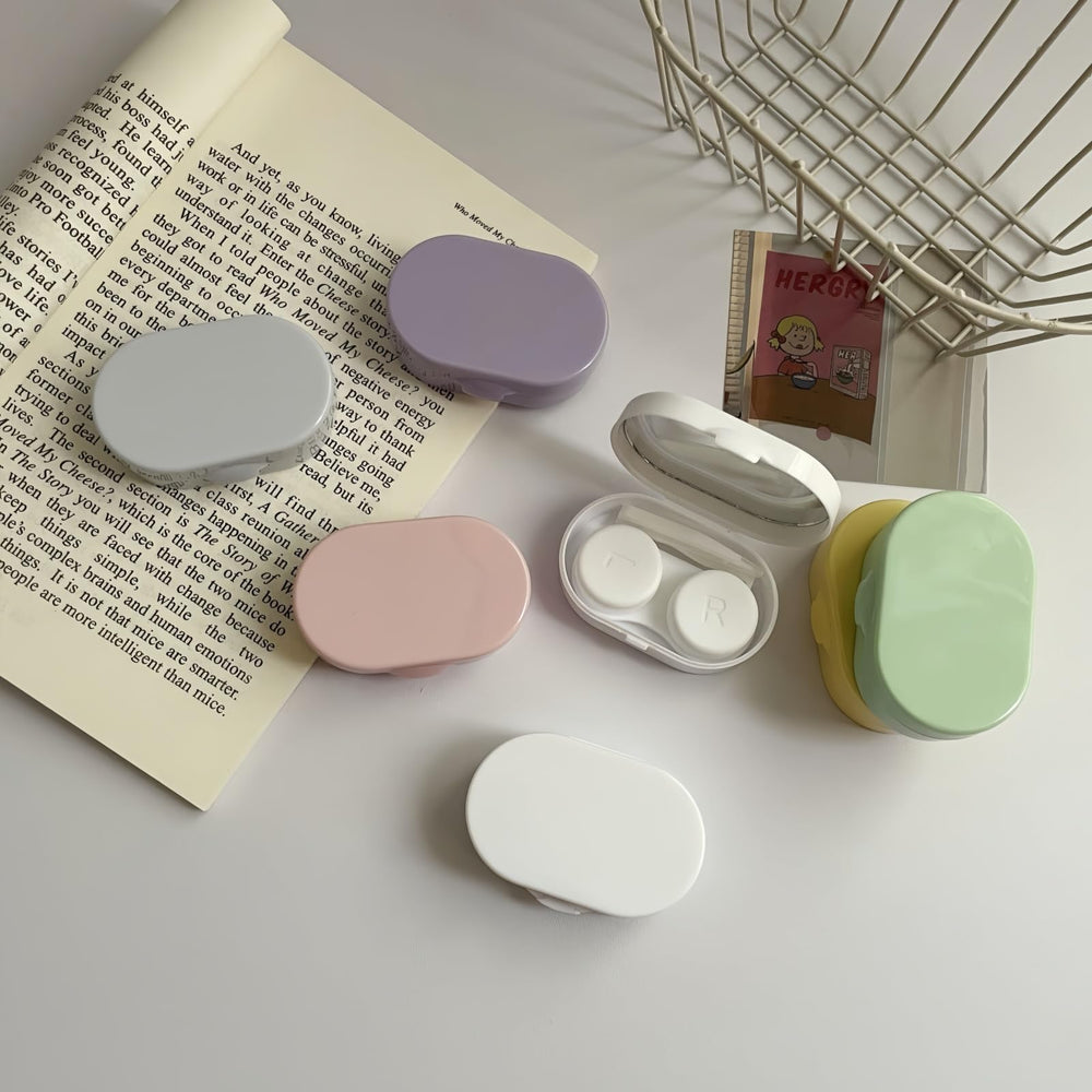 Open candy color contact lens case showing compartments