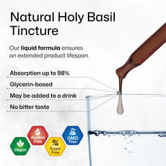 Pouring holy basil tincture into a beverage