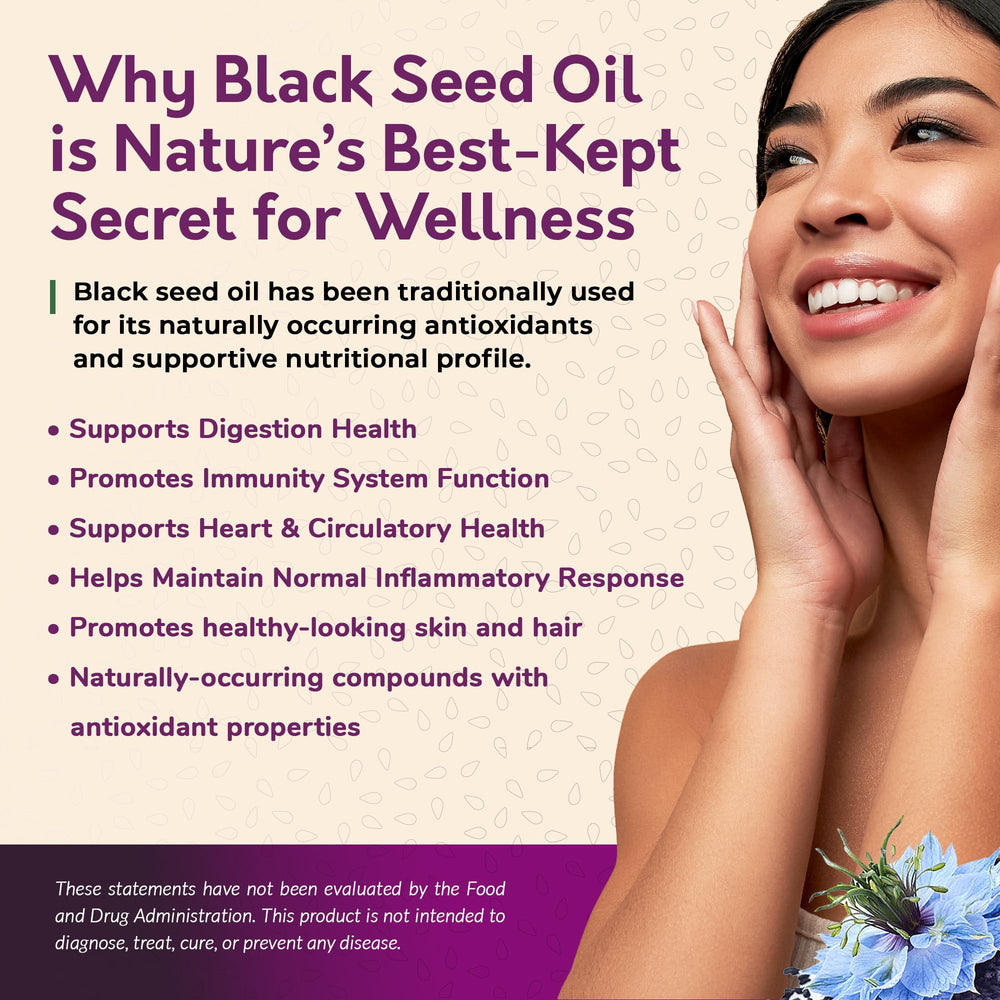 Unrefined black seed oil pouring from a glass bottle