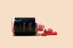 Close-up of a raspberry-watermelon probiotic gummy showing texture and color