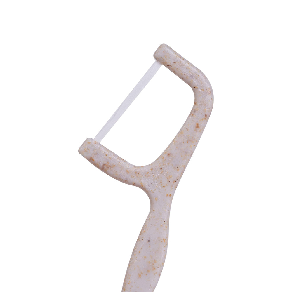 Floss picks packed in recyclable paper sleeve