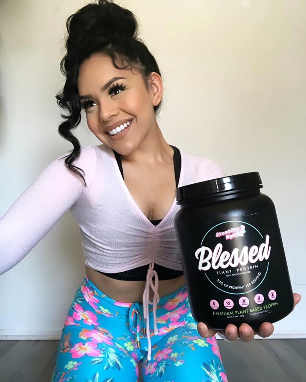 Blessed Vegan Protein Powder packaging showcases Strawberry Mylk flavor and no sugar added