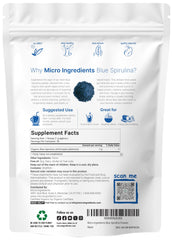Blue spirulina powder being scooped with a scoop