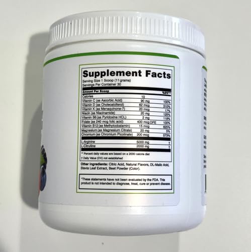 Powder dissolving in water to form a berry-flavored drink