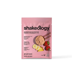BODi Shakeology Tropical Strawberry open bag highlights gluten-free, 0g added sugar.