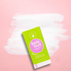 Close-up of Body Mint Woman bottle and green chlorophyll tablets