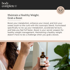 Lifestyle shot of a woman integrating Boost Drops into her daily routine