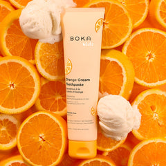 Orange Cream flavored Boka toothpaste tube and cap