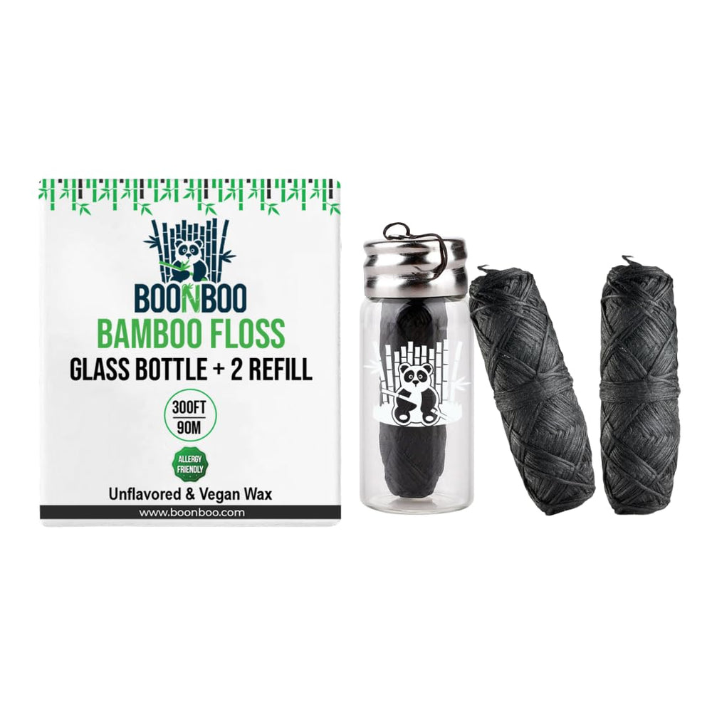 Charcoal woven dental floss in glass bottle with 2 refill heads