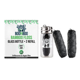 Charcoal woven dental floss in glass bottle with 2 refill heads