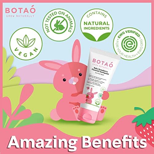 Toddler brushing with strawberry-flavored toothpaste
