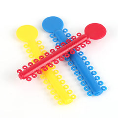 Braces rubber bands in multicolor packs for orthodontic use.